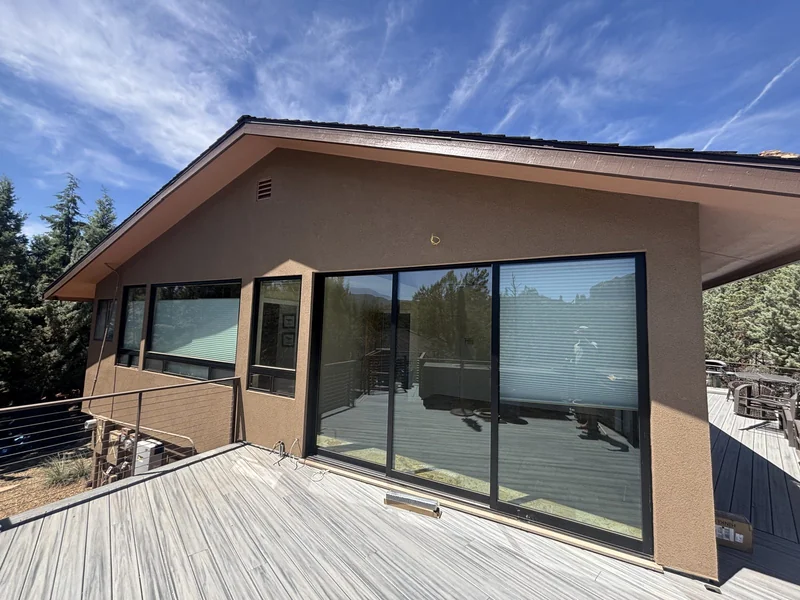 Finished exterior of a Sedona home with deck and cable railing after a full gut remodel