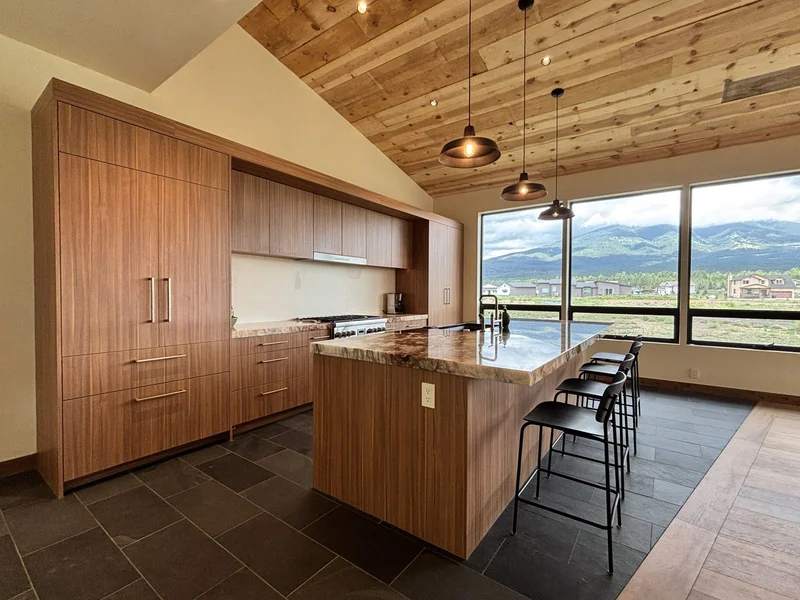 Finished custom kitchen cabinetry with a mountain view