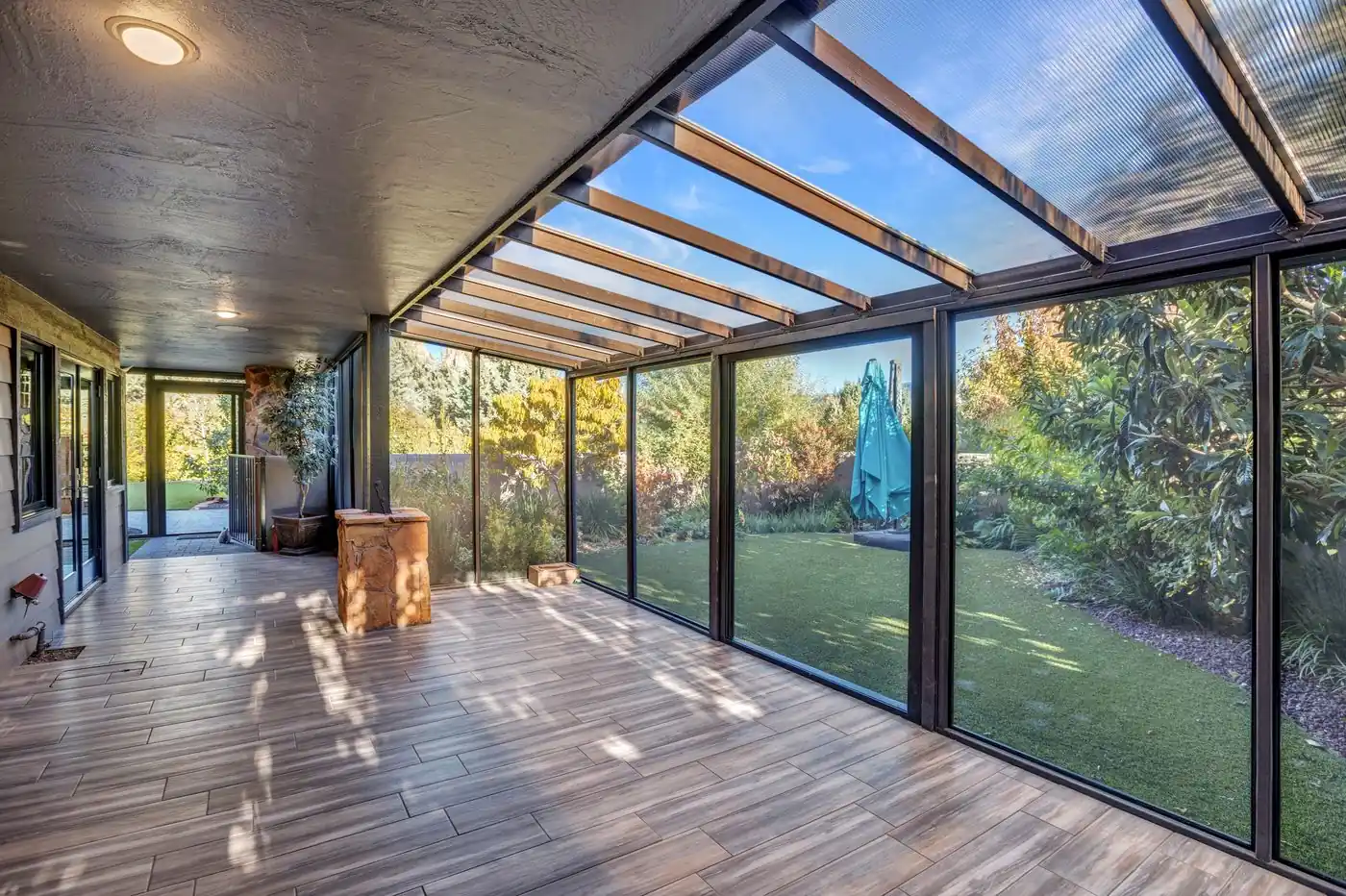 Covered glass walkway with full height windows