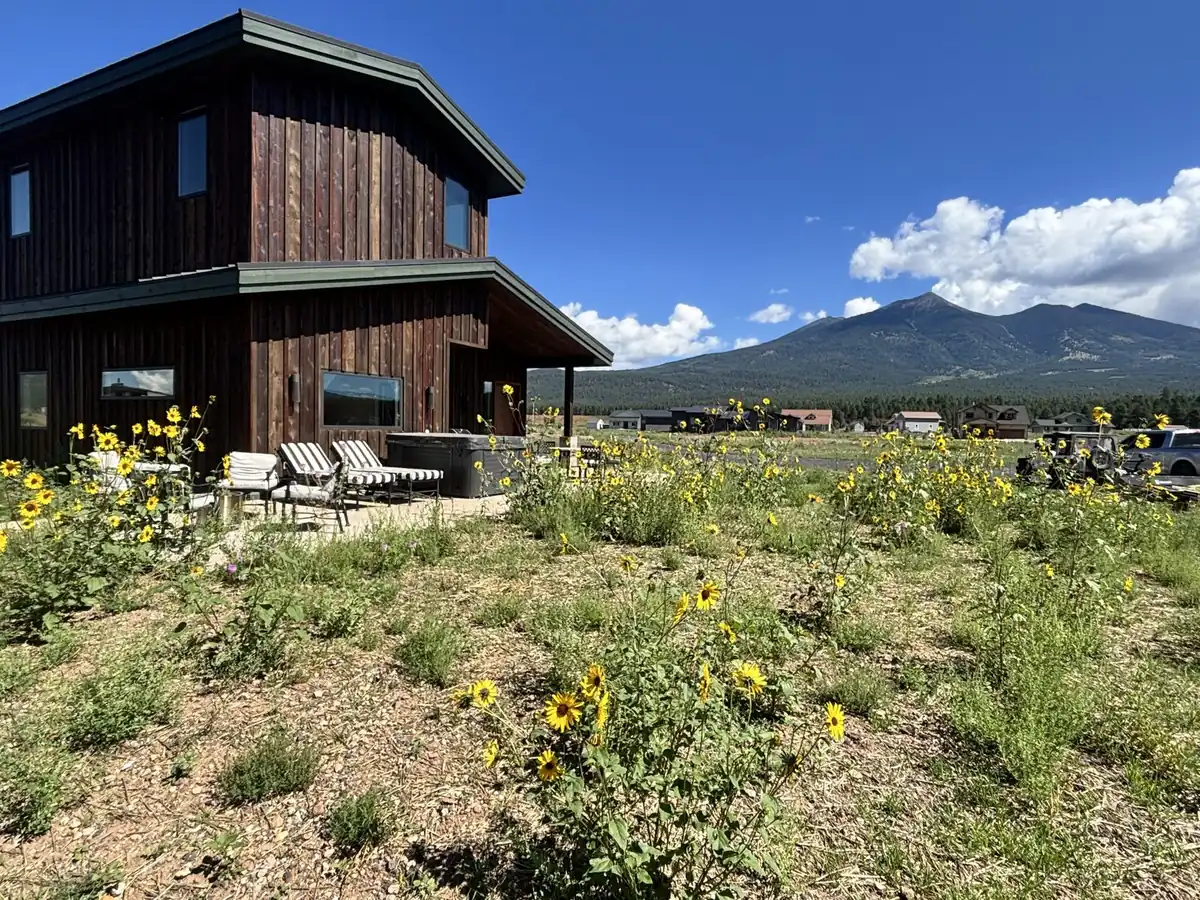 Finished custom home exterior in Flagstaff with mountain view