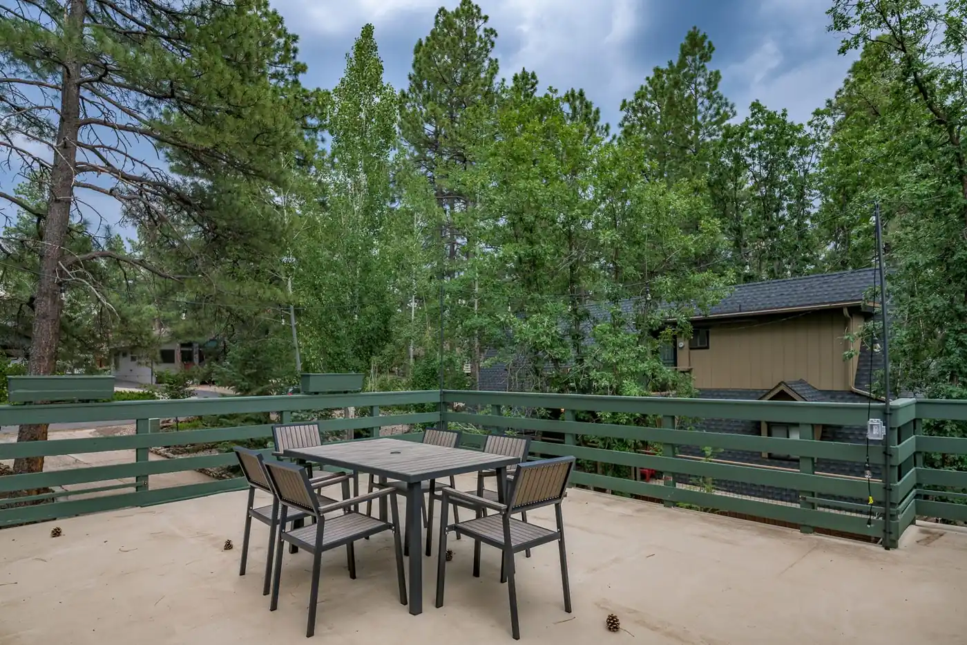 Home exterior patio with visible roofline and trim detail